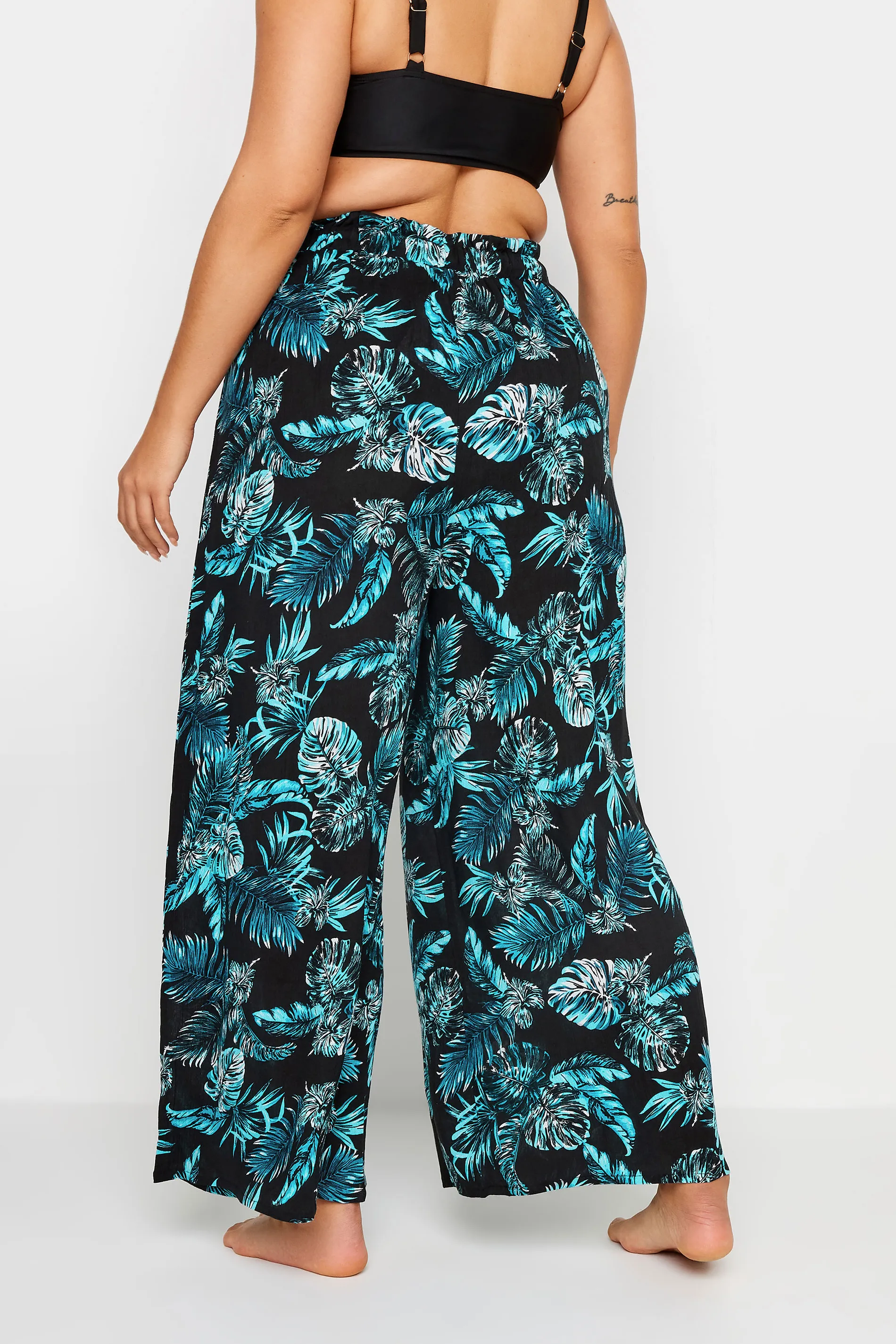 YOURS Curve Black Tropical Print Crinkle Tassel Trousers